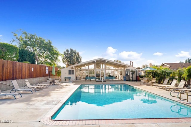 view of swimming pool with a patio area