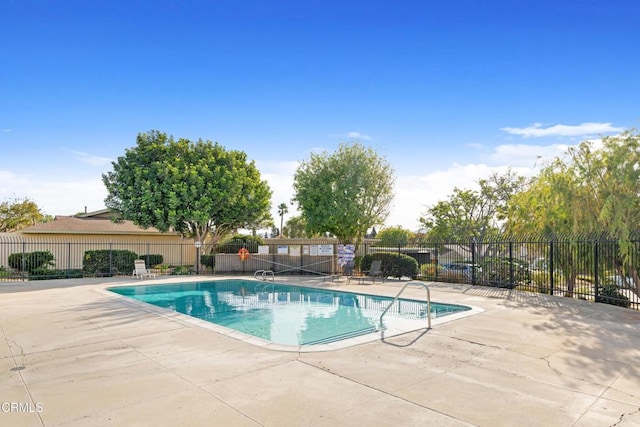 view of swimming pool featuring a patio