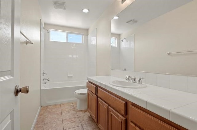 full bathroom with tile patterned floors, vanity, toilet, and shower / tub combination