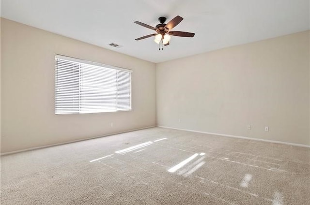 carpeted empty room with ceiling fan