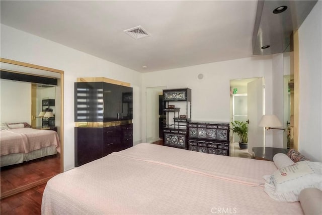 bedroom featuring dark hardwood / wood-style floors