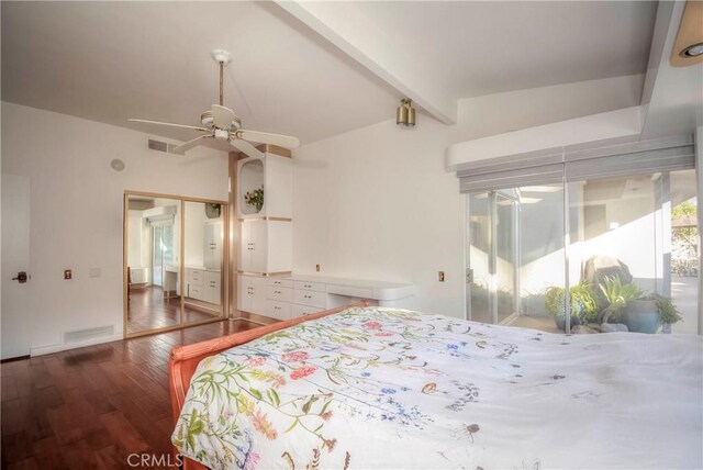 bedroom featuring beam ceiling, a closet, ceiling fan, and dark hardwood / wood-style flooring