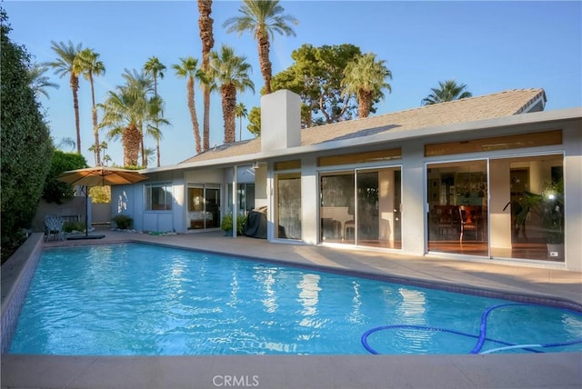 view of pool featuring grilling area