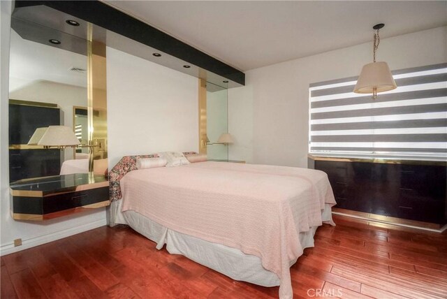 bedroom with hardwood / wood-style floors