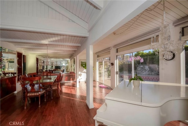 sunroom / solarium with vaulted ceiling with beams and wood ceiling