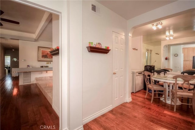 hallway with hardwood / wood-style flooring