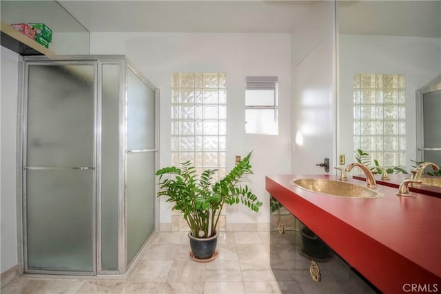 bathroom featuring walk in shower and sink