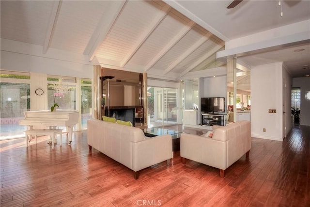 living room with wood-type flooring, vaulted ceiling with beams, and ceiling fan