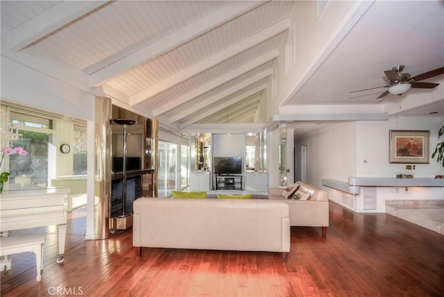 living room with hardwood / wood-style floors, vaulted ceiling with beams, and ceiling fan