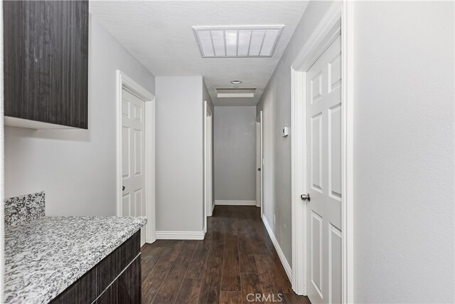 hall with dark hardwood / wood-style flooring