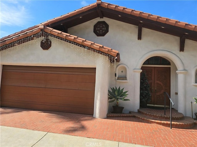 mediterranean / spanish house with a garage