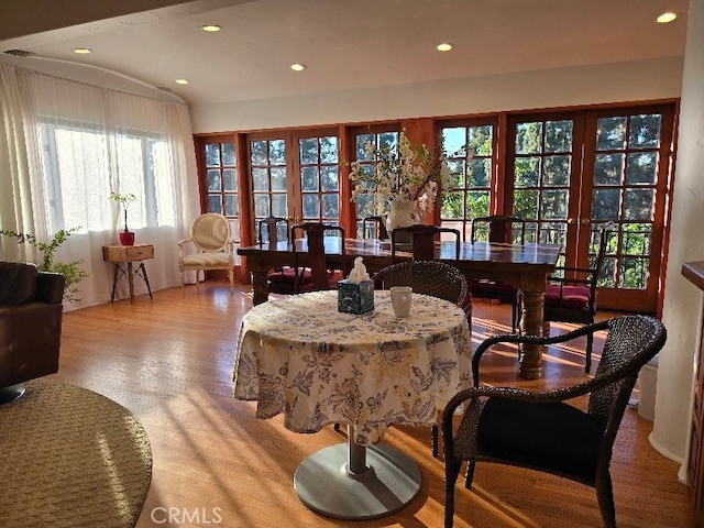 dining area featuring french doors and light wood-type flooring