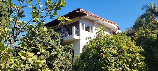 view of home's exterior featuring a balcony