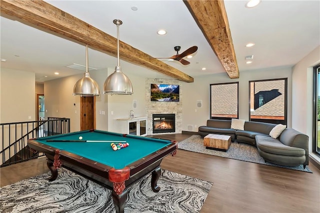 rec room with hardwood / wood-style floors, ceiling fan, a fireplace, pool table, and beam ceiling