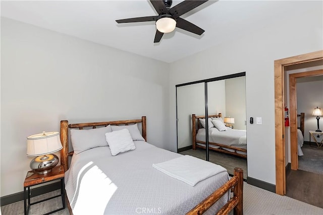 carpeted bedroom featuring a closet and ceiling fan