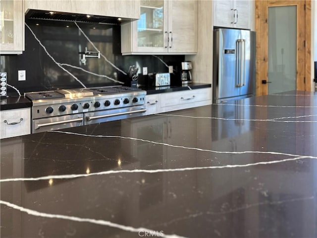 kitchen with tasteful backsplash, stainless steel appliances, and extractor fan