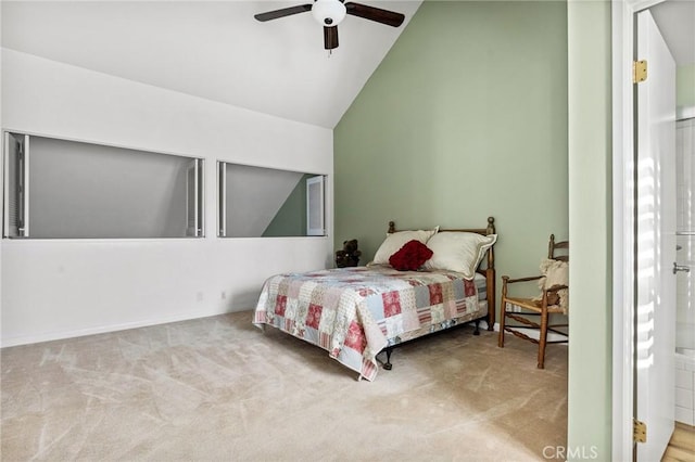 carpeted bedroom featuring connected bathroom, ceiling fan, and lofted ceiling