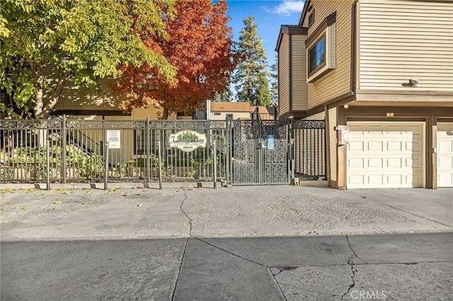 view of gate featuring a garage