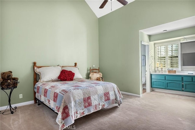 carpeted bedroom featuring connected bathroom, ceiling fan, and high vaulted ceiling