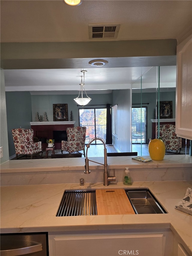 kitchen with white cabinets and pendant lighting