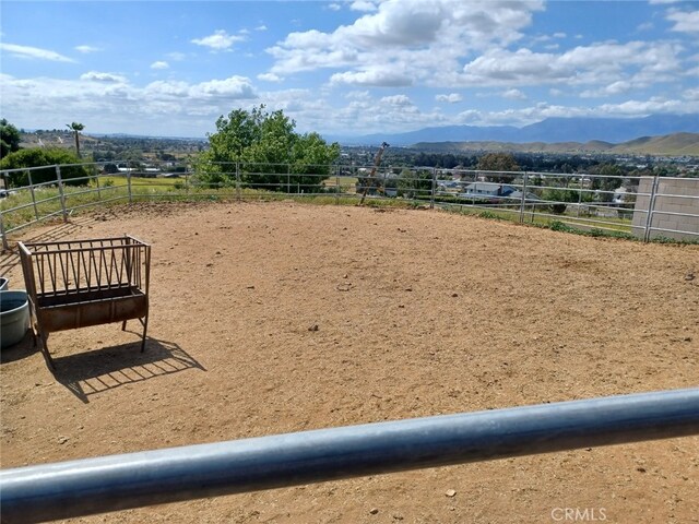 surrounding community with a mountain view and a rural view