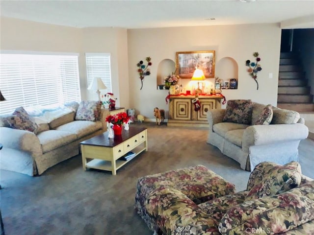 living room with dark carpet