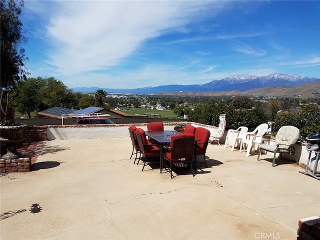 view of patio / terrace featuring a mountain view