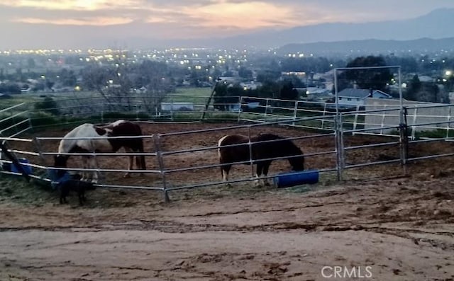 view of stable with a rural view