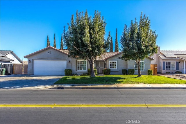 ranch-style house with a garage and a front lawn