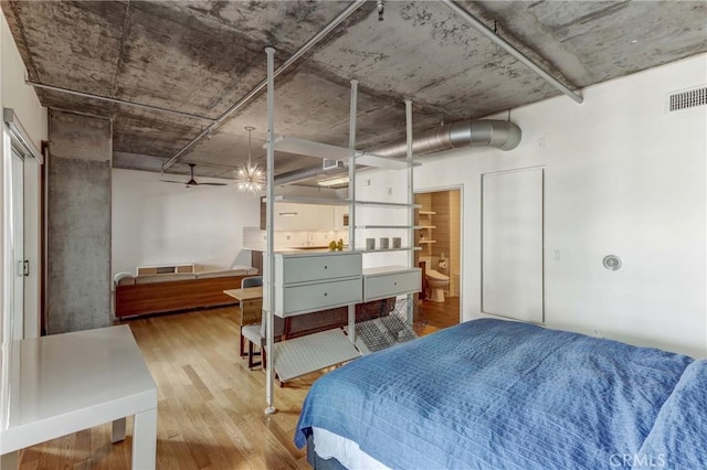 bedroom with wood-type flooring