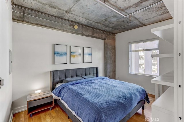 bedroom featuring hardwood / wood-style flooring