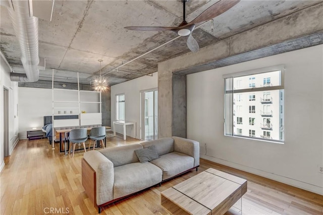 living room featuring ceiling fan and light wood-type flooring