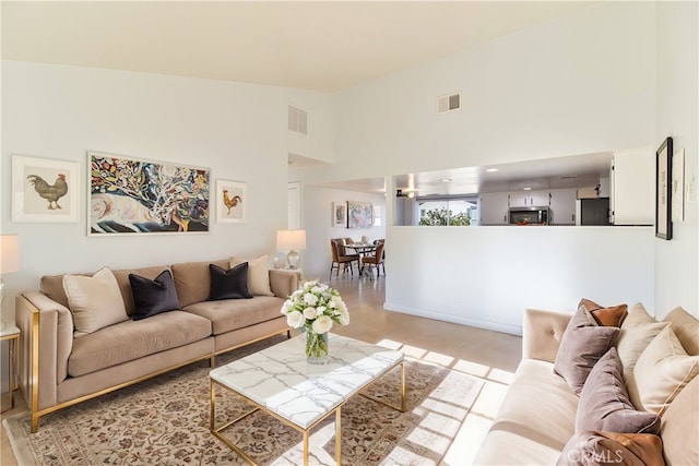 living room with a high ceiling