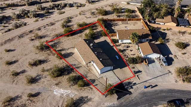 6556 Lupine Ave Unit 29, Palms, CA 92277 - aerial view of sparsely populated area with property parcel outlined and a desert landscape