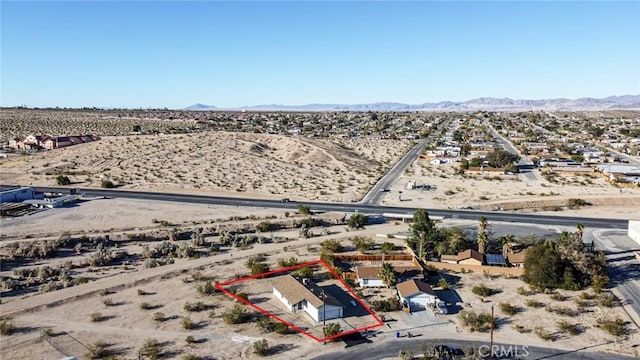 birds eye view of property with a mountain view