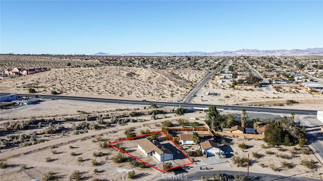 6556 Lupine Ave Unit 29, Palms, CA 92277 - overview of rural landscape with a desert landscape, property boundaries highlighted, and a mountainous background