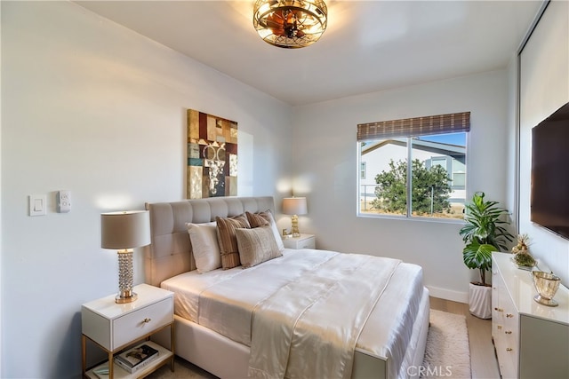 bedroom with light colored carpet