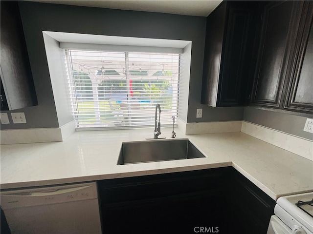 kitchen featuring dishwasher and sink