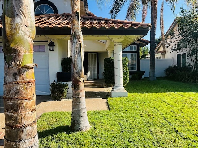 doorway to property with a yard