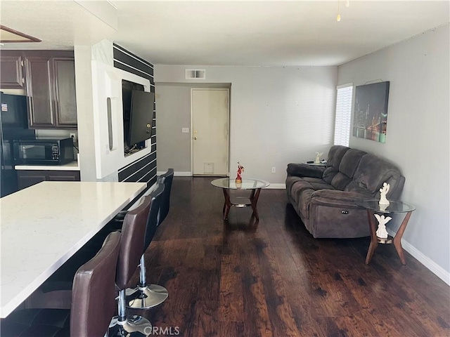 living room with dark wood-type flooring