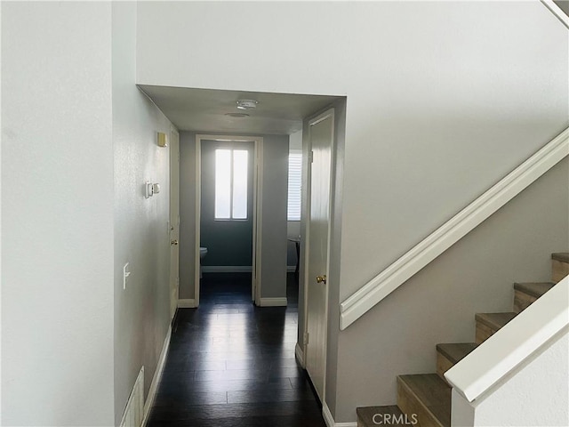 hall with dark hardwood / wood-style floors