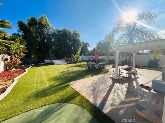 view of yard with a pergola and a patio