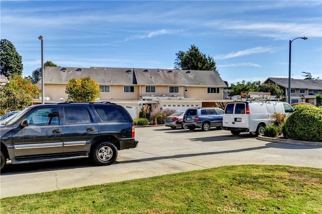 view of parking with a residential view