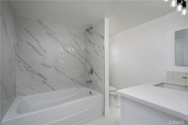 bathroom with toilet, marble finish floor, bathtub / shower combination, and vanity