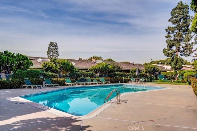 community pool featuring a patio