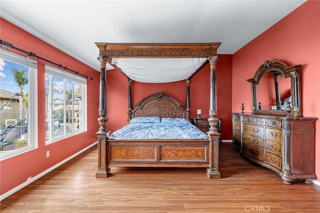 bedroom with light hardwood / wood-style flooring