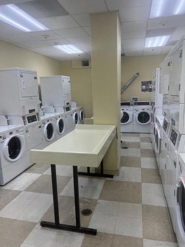 clothes washing area featuring washing machine and dryer and stacked washer / drying machine