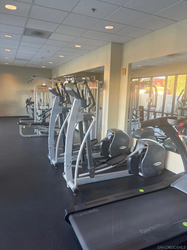 workout area featuring a drop ceiling