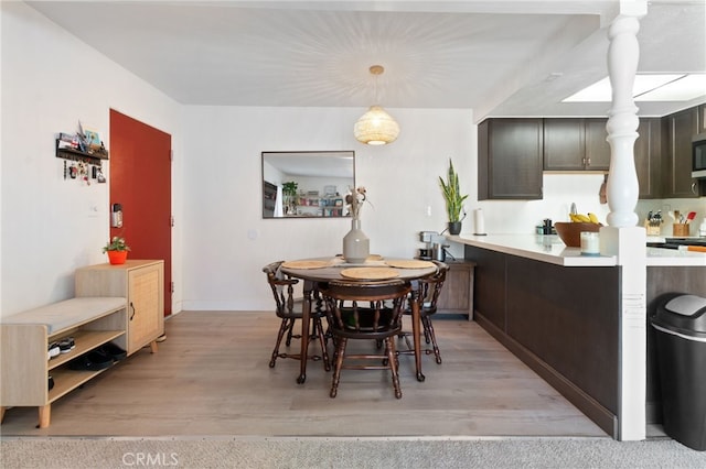 dining area with light hardwood / wood-style floors