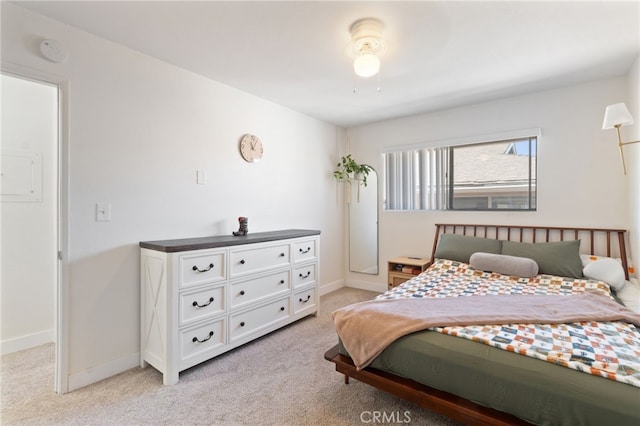 bedroom with ceiling fan and light carpet